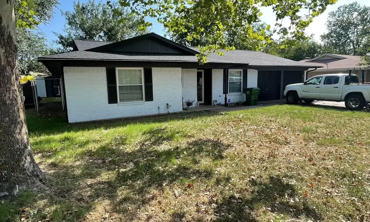 Professional roofing crew working on a residential roof in Johnson City